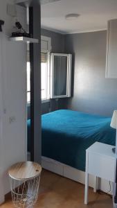 A bed or beds in a room at Appartement sur Empuriabrava à 100 m de la mer