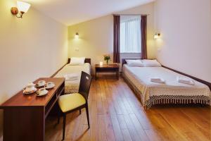 Postel nebo postele na pokoji v ubytování Medova Pechera + 32 fotografií
