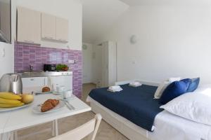 Posteľ alebo postele v izbe v ubytovaní Studio Apartman Blue View
