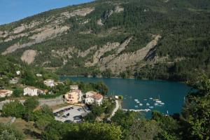 an aerial view of a lake with boats in it at "Verdon Yourtes" Camping à la ferme in Angles