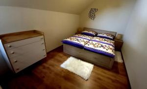 A bed or beds in a room at Vila Devana