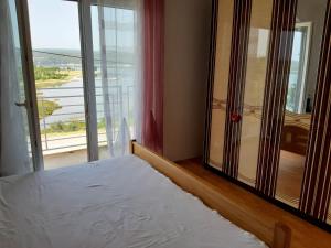 Postel nebo postele na pokoji v ubytování Apartment Karlo