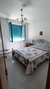 Ένα ή περισσότερα κρεβάτια σε δωμάτιο στο Maison a San Cataldo