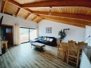 a living room with a couch and a table at Villa Luz II - NEW - Private Outdoor Area in Santa Cruz