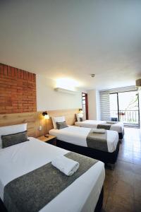 Postel nebo postele na pokoji v ubytování Hotel Cabo de la Vela Medellin