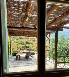 a view from a window of a patio with a table at Kypri Apartments in Kipri
