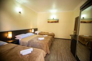 Ένα ή περισσότερα κρεβάτια σε δωμάτιο στο Hotel Chveni Ezo