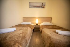 Ένα ή περισσότερα κρεβάτια σε δωμάτιο στο Hotel Chveni Ezo