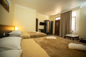 Ένα ή περισσότερα κρεβάτια σε δωμάτιο στο Hotel Chveni Ezo