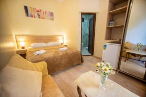 Ένα ή περισσότερα κρεβάτια σε δωμάτιο στο Hotel Chveni Ezo