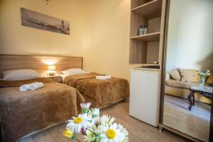 Ένα ή περισσότερα κρεβάτια σε δωμάτιο στο Hotel Chveni Ezo