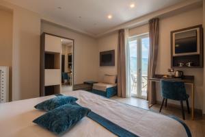 A bed or beds in a room at San Lorenzo - Boutique Hotel & SPA