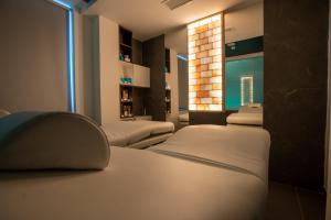 A bed or beds in a room at San Lorenzo - Boutique Hotel & SPA