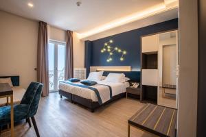 A bed or beds in a room at San Lorenzo - Boutique Hotel & SPA
