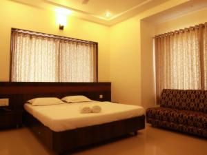 Katil atau katil-katil dalam bilik di Hotel Sai Ramanand