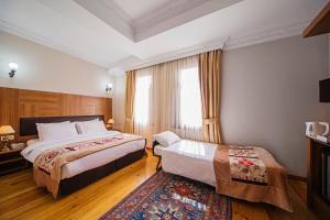 Postel nebo postele na pokoji v ubytování Hippodrome Hotel