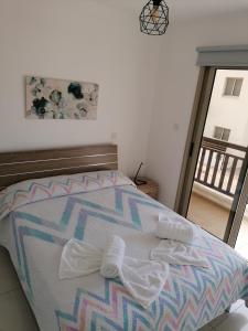 a bedroom with a bed with at Villa Naxos in Protaras