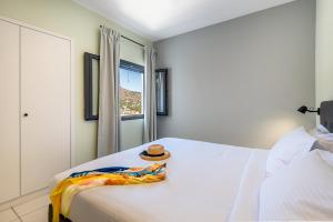Postel nebo postele na pokoji v ubytování Minois Boutique Hotel + 37 fotografií