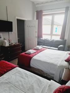 Postel nebo postele na pokoji v ubytování Dalry Guesthouse