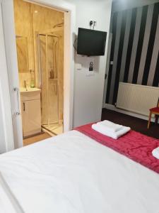 Postel nebo postele na pokoji v ubytování Dalry Guesthouse