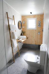 a bathroom with a toilet and a sink at Sete Cidades Nature Villa in Sete Cidades