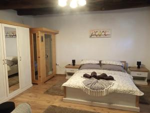 A bed or beds in a room at Kiscsermely Vendégház