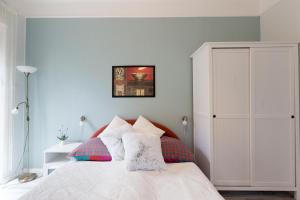 A bed or beds in a room at Holiday House Siófok