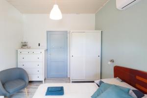 A bed or beds in a room at Holiday House Siófok