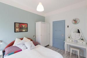 A bed or beds in a room at Holiday House Siófok