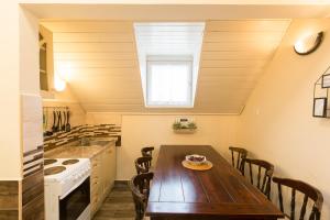 A kitchen or kitchenette at Holiday House Siófok