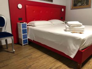 A bed or beds in a room at B&B Magada