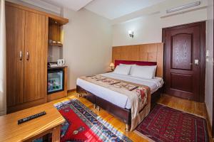 Postel nebo postele na pokoji v ubytování Hippodrome Hotel