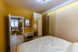 เตียงในห้องที่ APARTMAN DOLAR