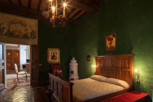 מיטה או מיטות בחדר ב-Appartamento del Capitano