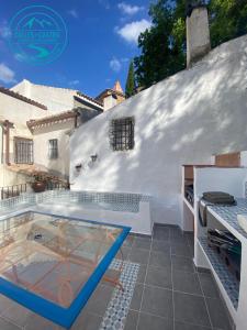 a villa with a swimming pool and a house at Calle Horno in Castril