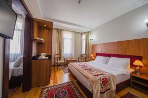 Postel nebo postele na pokoji v ubytování Hippodrome Hotel