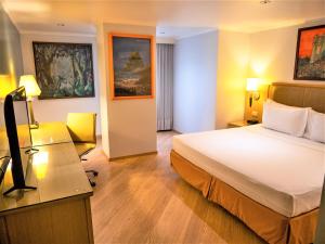 Postel nebo postele na pokoji v ubytování Grand Hotel Guayaquil, Ascend Hotel Collection