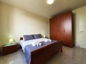 Letto o letti in una camera di Via Ugento Apartments - a pochi passi dalle spiagge
