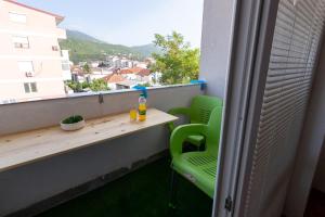 a table and chairs on a balcony with a view at S-Apartment Ohrid in Ohrid