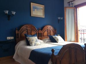 Säng eller sängar i ett rum på Hotel Rural Los Roturos