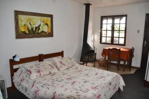 Ένα ή περισσότερα κρεβάτια σε δωμάτιο στο Hotel Pousada Dos Pinheiros