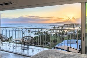 a balcony with a view of the ocean at Waikiki Shore 1116 Beachfront in Honolulu