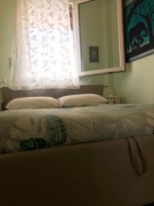 Кровать или кровати в номере Appartamento VillaGio - Vista bella
