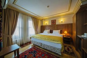 a hotel room with a bed and a window at Apart Hotel Hippodrome in Istanbul