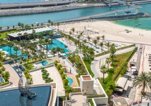 an aerial view of the pool and beach at a resort at Elegant 2 BR Apt with spectacular views in the Address in Dubai