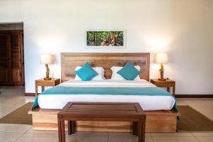 Postel nebo postele na pokoji v ubytování Hotel L'Archipel