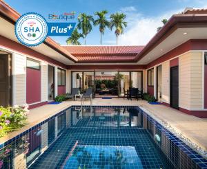 a villa with a swimming pool in a house at Boutique Resort Private Pool Villa - SHA Extra Plus in Ban Pa Khlok