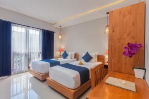 Postel nebo postele na pokoji v ubytování Ning Villa Ubud by GenuineHost + 13 fotografií