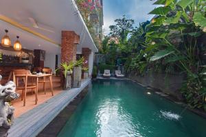 Bazén v ubytování Ning Villa Ubud by GenuineHost nebo v jeho okolí