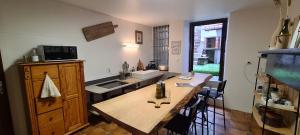 a kitchen with a wooden counter and a sink at Les Chemins d'Elika in Saint-Jean-Pied-de-Port
